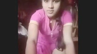 A beautiful girl in a natural setting pleasures herself with her hands