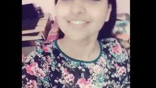 Young college girl with big breasts gets naughty on camera