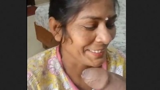 Mature Indian woman gives a blowjob in a homemade video