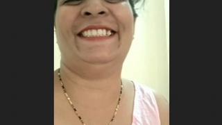 Aunty Tia's beautiful face in a desi porn video
