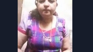 Aunty's seductive act of exposing her dress