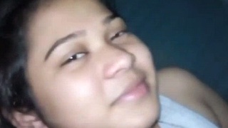A beautiful girl and her lover talk in bed