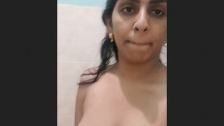 Hot Indian girl flaunts her breasts and pussy in seductive display