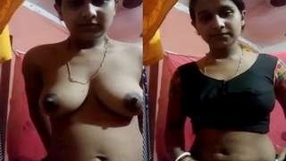 Desi boudi strips and reveals her big boobs and pussy