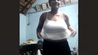 Watch a Tamil girl flaunt her big boobs in this steamy video