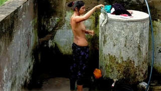Desi girl takes a bath behind the door in part 2