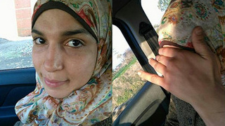 Muslim woman in hijab indulges in car play