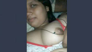 Busty Indian woman's breasts pressed together