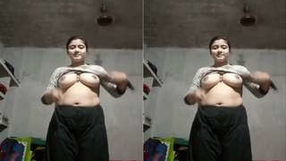 A stunning Bangla girl flaunts her breasts in a seductive display