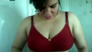Radha Bhabhi's seductive performance in a red bra and panties