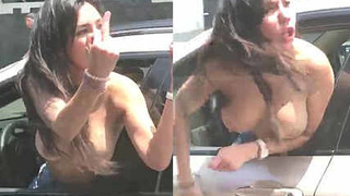 Naked woman screams in a car on a public road