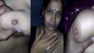 Mature woman's big breasts fondled by her neighbor