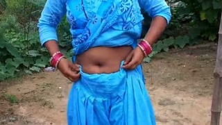 Desi bhabi relieves herself in village setting