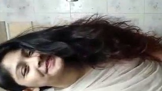 Nude Indian girl in sari takes a bathroom selfie