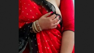 MILF with big boobs enjoys playing in a saree