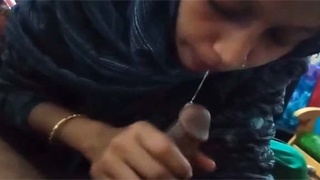 Desi village wife gives a blowjob to her husband's friend on camera