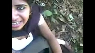 Desi couple enjoys a blowjob in the forest with a hot Tamil school girl
