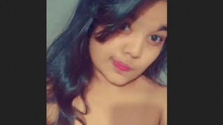 Cute girl flaunts her naked body in front of the camera