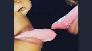 Passionate couple engages in kissing and sexual activity