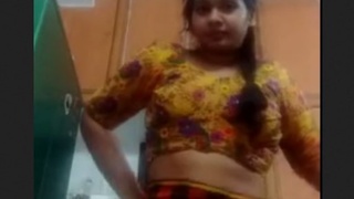 Cute Indian girl shows off her naked body and brushes her pussy