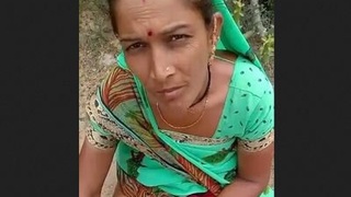 Indian woman gives a blowjob to an older man
