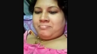 Watch a sexy bhabhi indulge in some finger play and cum tasting
